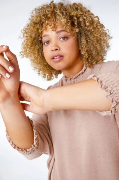 Camel Curve Frill Neck Asymmetric Stretch Top