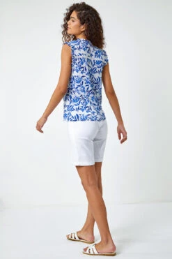 Blue Sleeveless Floral Print Ruffle Blouse -Outlet Modi Qube Store d6fc1905 8aee 4e8d 8dc2 0ae3b6b7ac1b