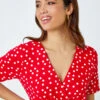 Red Spot Print Side Twist Wrap Top